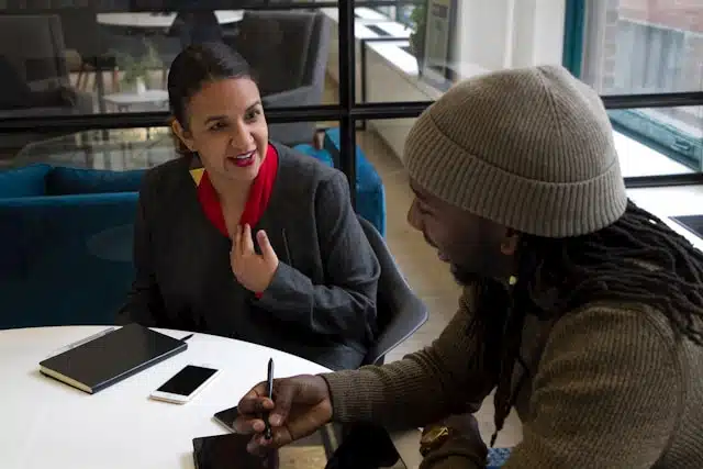 A title loan representative assisting a client, offering a friendly and professional interaction. 